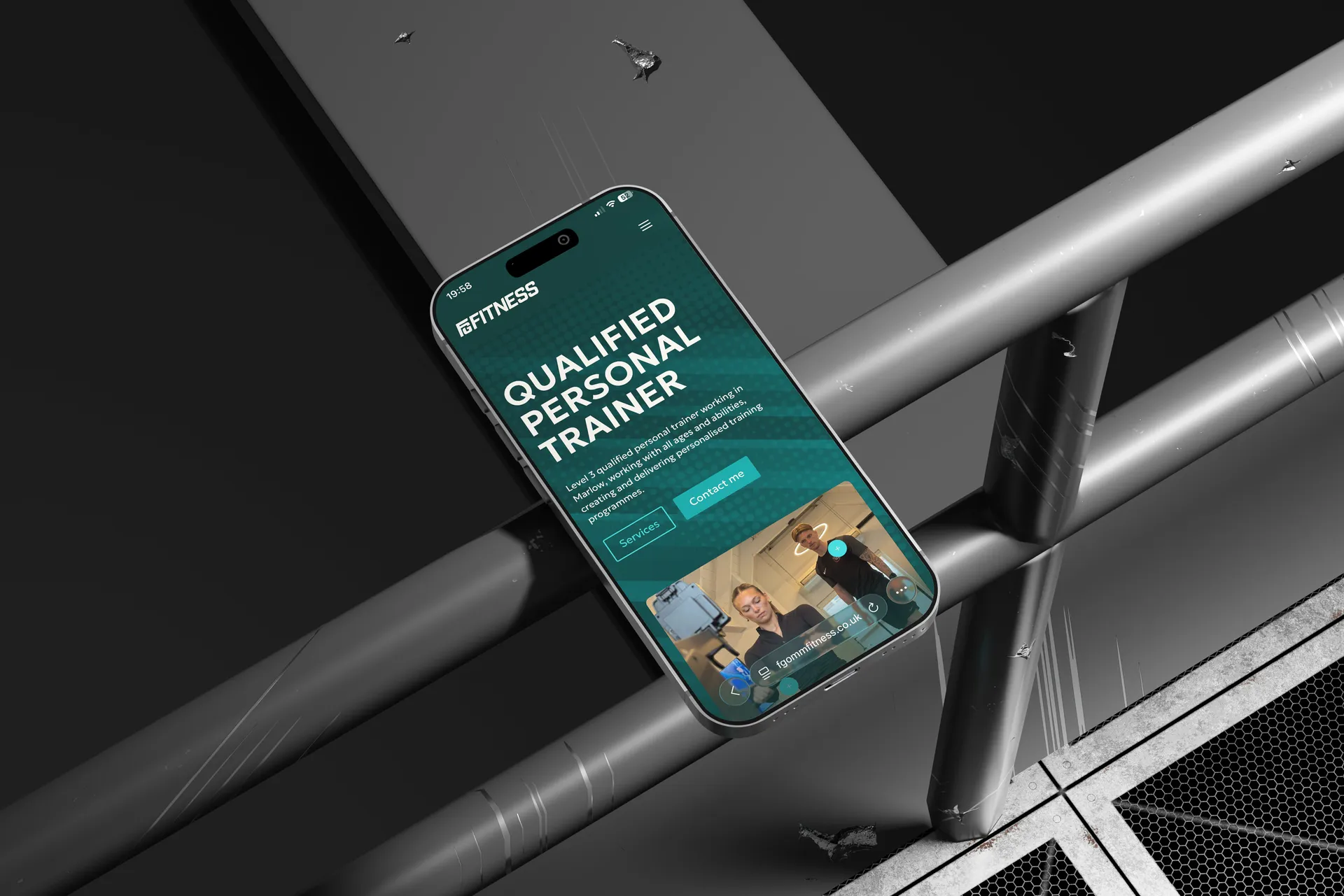 Finley Gomm Fitness website on phone. mobile mockup by Berlew Design Studio.
