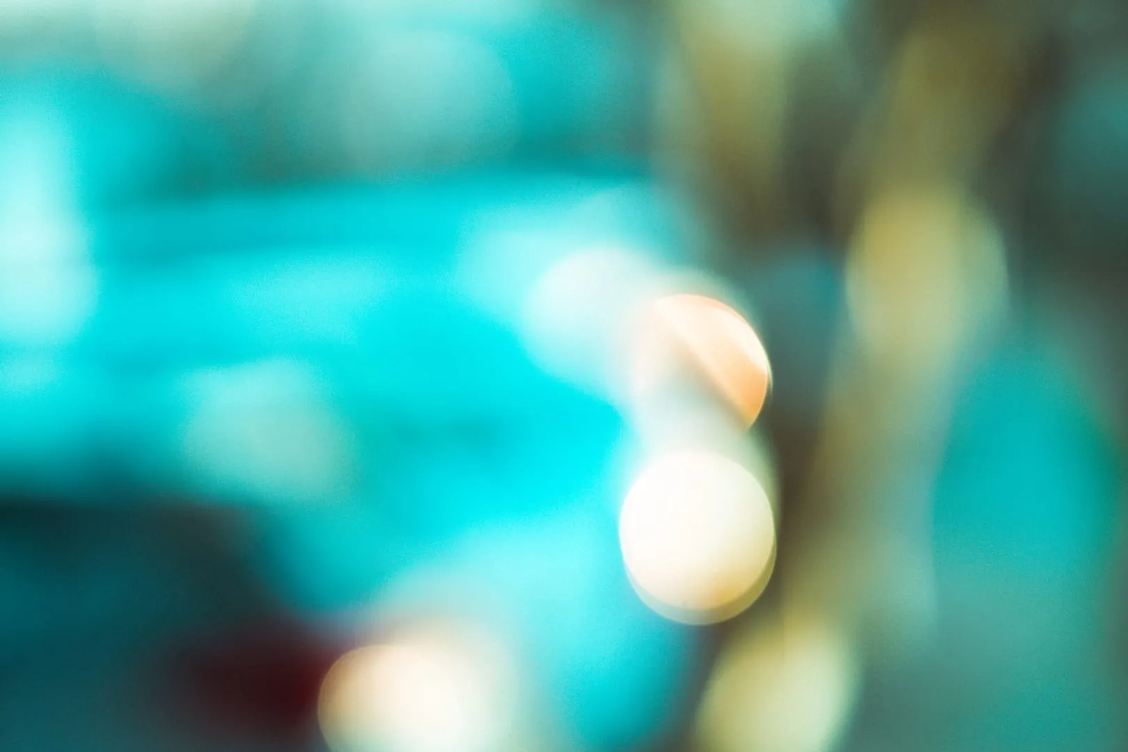 Soft out-of-focus blue and yellow light circles.